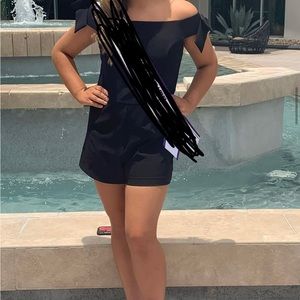 Black romper with bows at the shoulders